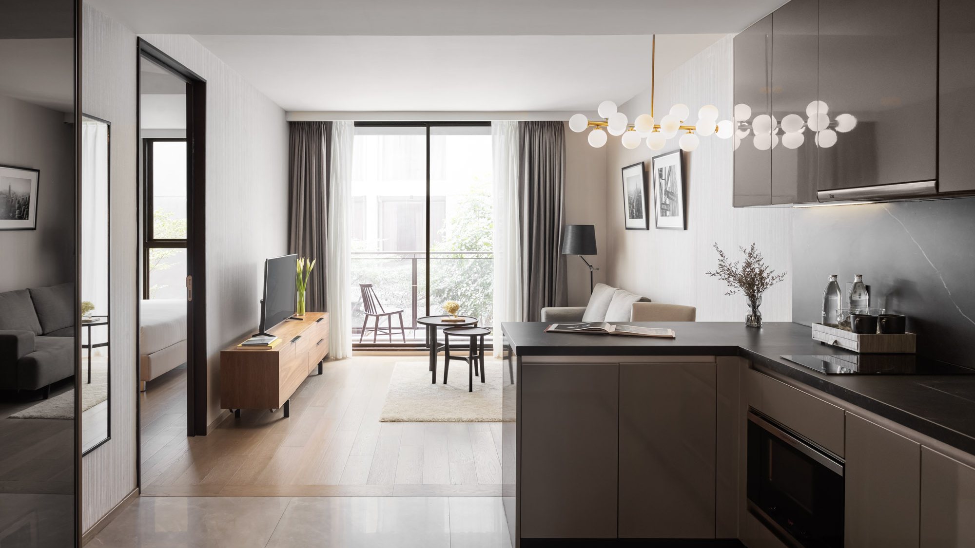 Walton Suites kitchen opening into the dining and living area