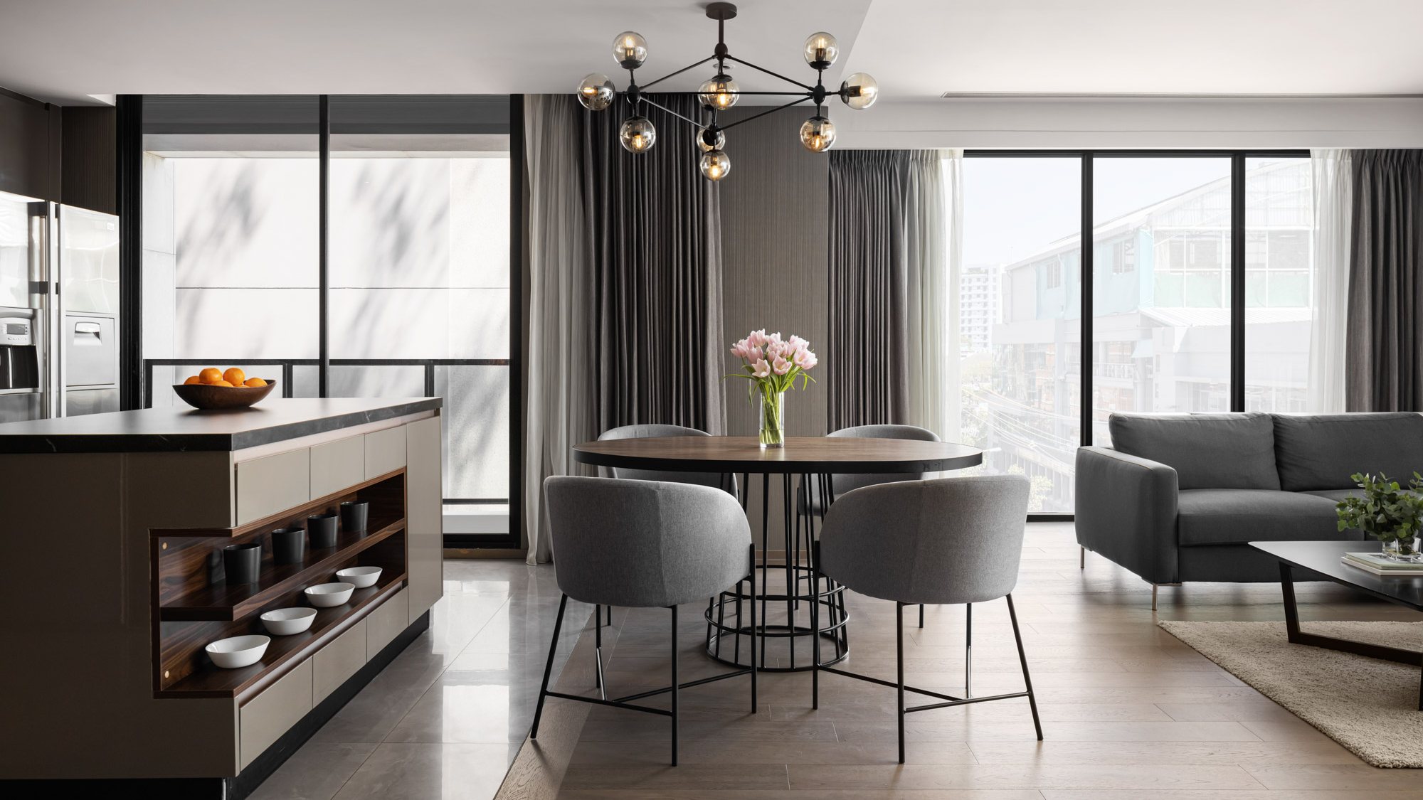 Walton Suites living and dining area with a kitchen and large windows